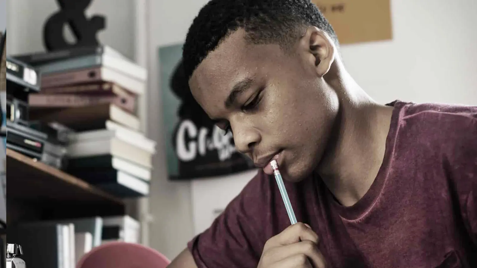 young boy studying commas