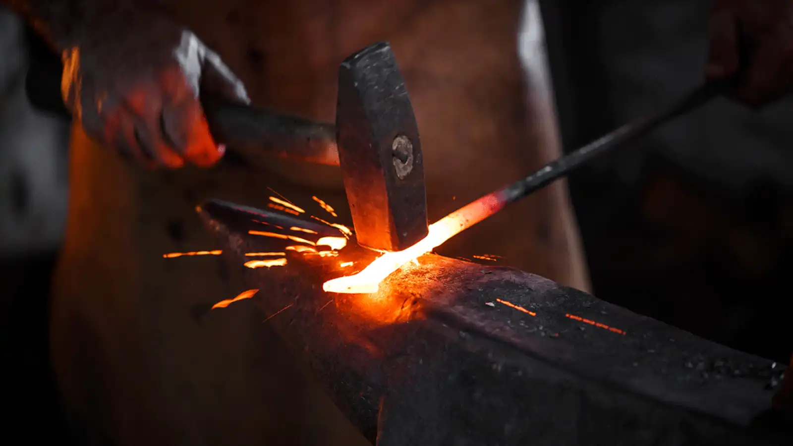blacksmith hammering metal