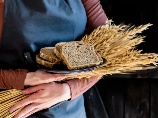 farmer's wife with wheat and bread