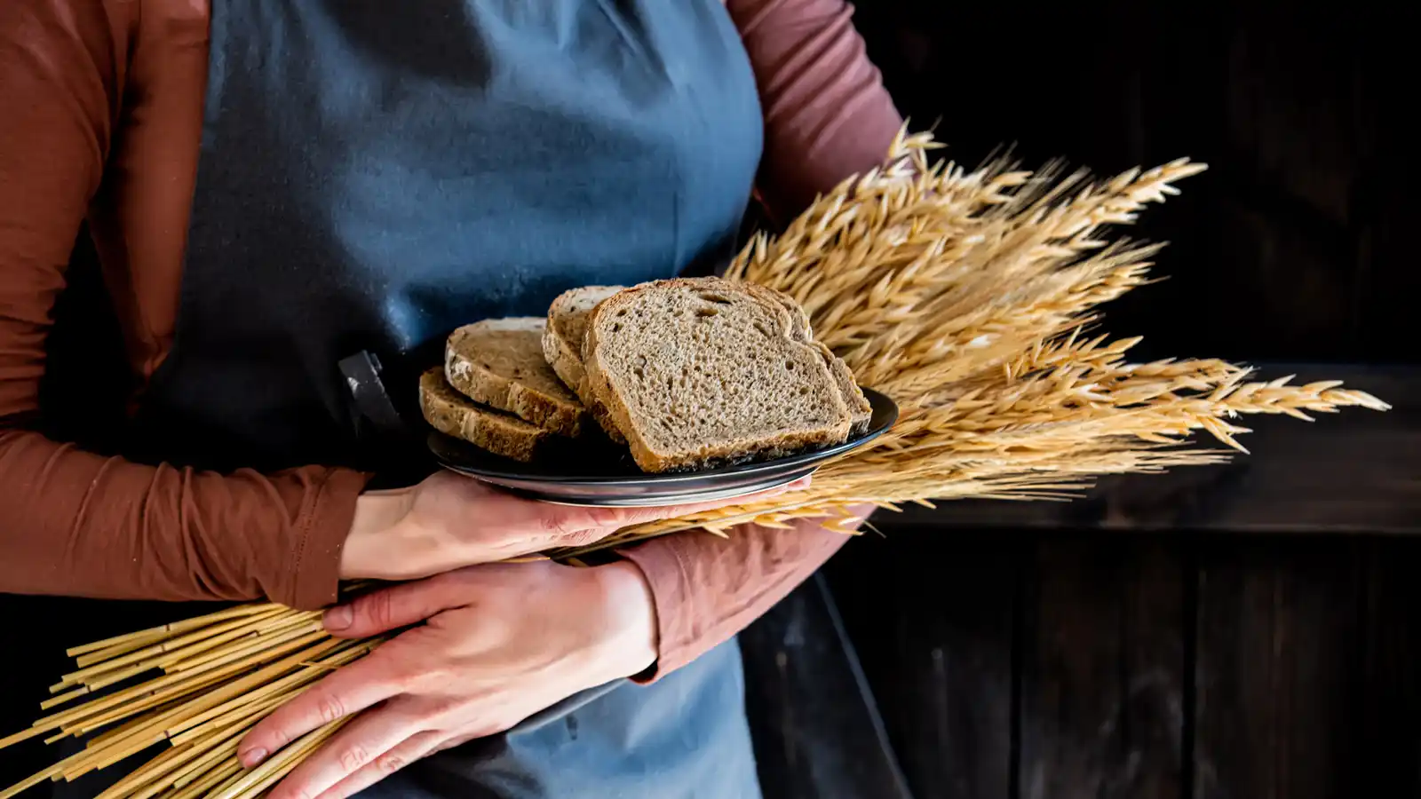 farmer's wife with wheat and bread